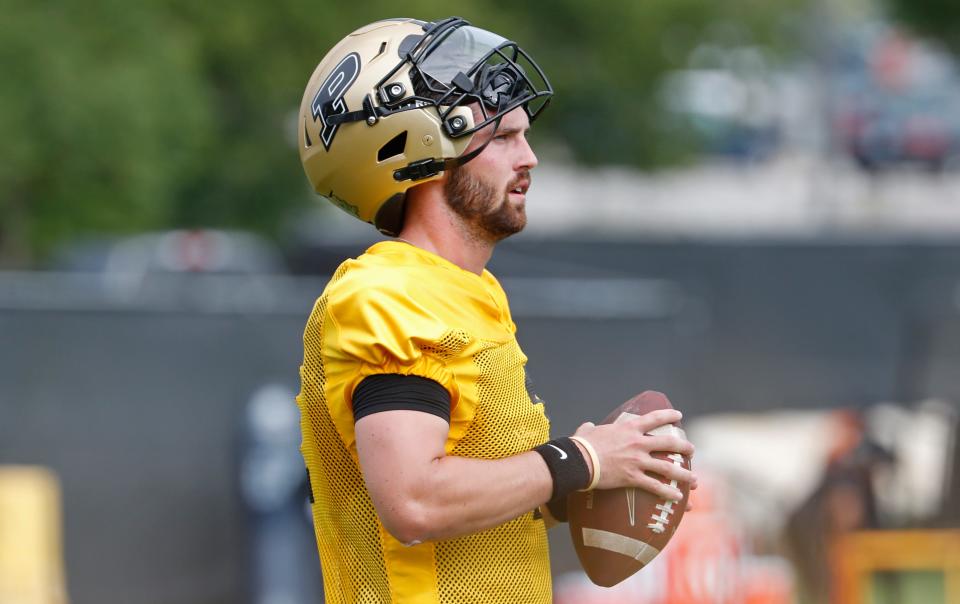 Purdue Boilermakers quarterback Hudson Card (1) holds onto a football Wednesday, July 31, 2024, during Purdue football practice at Bimel Outdoor Practice Complex in West Lafayette, Ind.