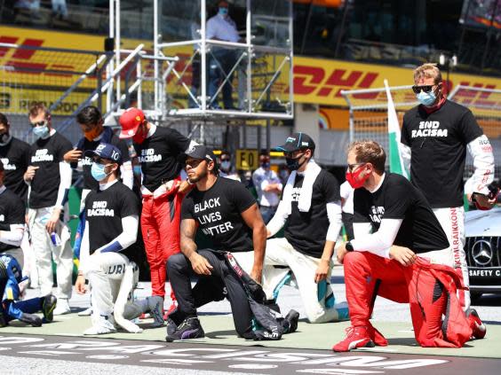 Hamilton has taken a knee before each of the three races this season (Getty)