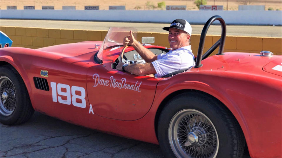 Shelby Legendary Car's replica of Dave MacDonald's winning Cobra with his son Rich behind the wheel.