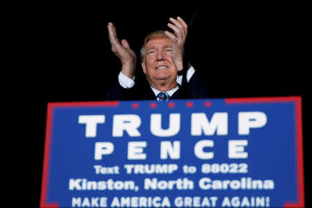 Republican presidential nominee Donald Trump attends a campaign event on the tarmac of the airport in Kinston, North Carolina, U.S. on October 26 2016. REUTERS/Carlo Allegri/File Photo