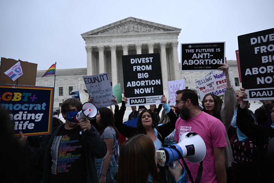 Pro-life and pro-choice demonstrators gather in front of the U.S. Supreme Court in Washington, DC, on May 3, 2022, following the publication of a draft court opinion foreshadowing the overturn the 1973 Roe v. Wade decision.