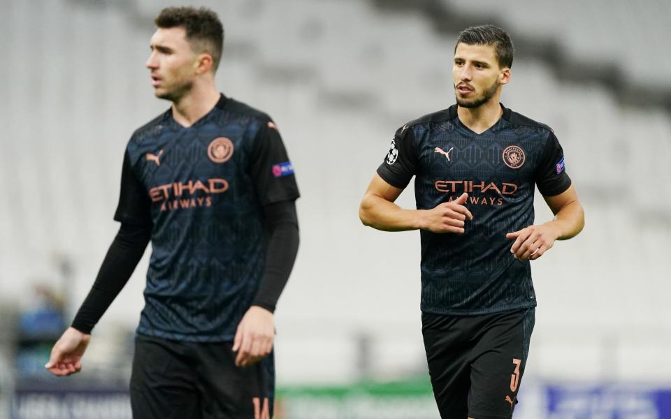 Aymeric Laporte and Ruben Dias of Manchester City during the UEFA Champions League Group C stage match between Olympique de Marseille and Manchester City at Stade Velodrome on October 27, 2020 in Marseille, France.  - GETTY IMAGES