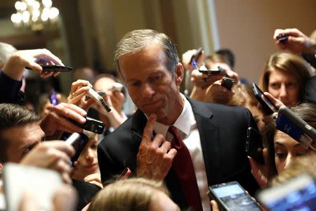 FILE PHOTO: Sen. John Thune (R-SD) speaks with reporters about the Senate health care bill on Capitol Hill in Washington, U.S., July 13, 2017. REUTERS/Aaron P. Bernstein