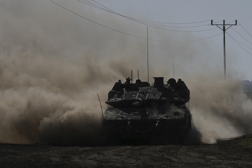 An Israeli tank moves near the Gaza Strip border in southern Israel, Wednesday, March 13, 2024. (AP Photo/Tsafrir Abayov)