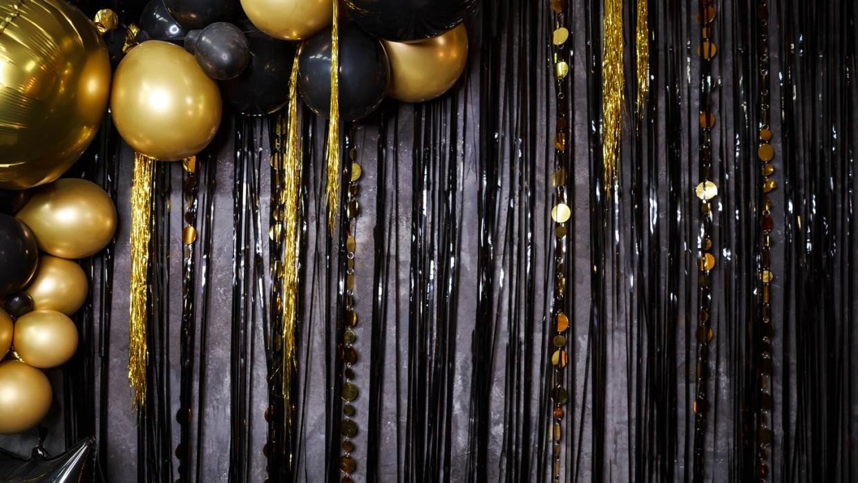 shiny gold, black balloons new year baubles, glossy sparkles