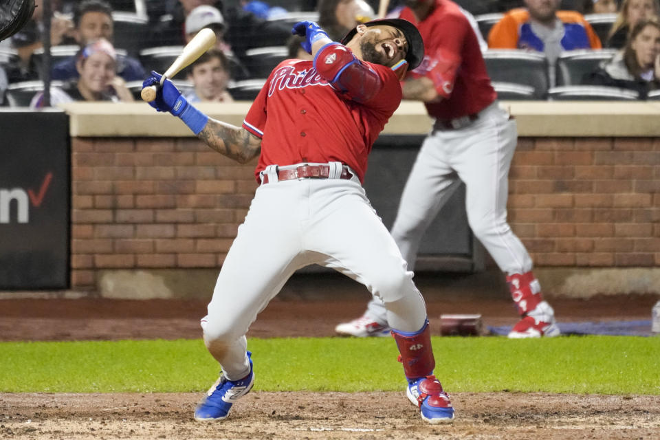 Philadelphia Phillies' Edmundo Sosa reacts after being hit by a pitch from New York Mets relief pitcher Phil Bickford during the fifth inning of the second game of a baseball doubleheader, Saturday, Sept. 30, 2023, in New York. (AP Photo/Mary Altaffer)