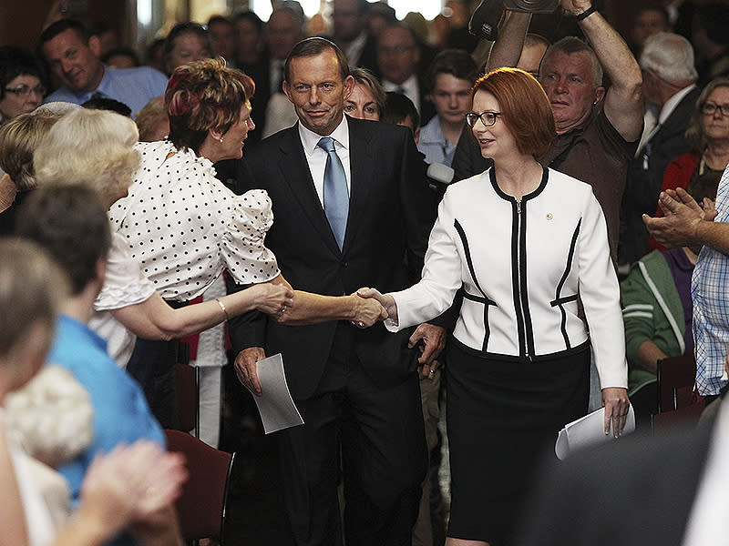 <p>Julia Gillard followed by Tony Abbott during the forced adoptions apology in Canberra.</p>