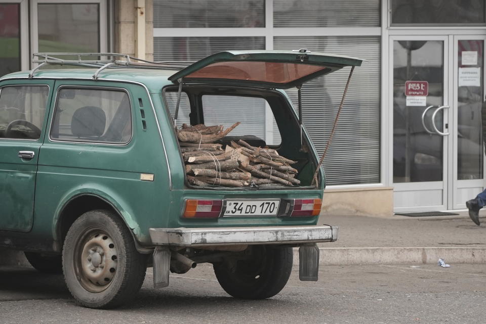 Firewood put up for sale are seen in a car trunk in Stepanakert, the capital of the separatist region of Nagorno-Karabakh, also known as Artsakh, on Thursday, Dec. 15, 2022. Protesters claiming to be ecological activists have blocked the only road leading from Armenia to Nagorno-Karabakh for more than a month, leading to increasing food shortages. In the region have been periodic shutoffs of gas and electricity to the region during the dispute. (Edgar Harutyunyan/PAN Photo via AP)