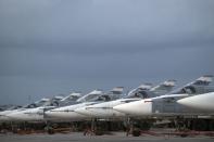 <p> FILE- In this file photo dated Friday, March 4, 2016, Russian warplanes are parked at Hemeimeem air base in Syria. A Russian reconnaissance aircraft was brought down over the Mediterranean Sea as it was returning to its home base inside Syria, killing all 15 people on board, the Russian defense ministry said Tuesday Sept. 18, 2018. (AP Photo/Pavel Golovkin, FILE) </p>