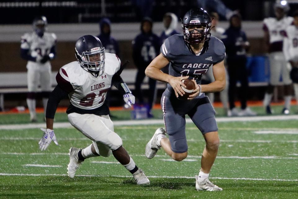 Benedictine's Luke Kromenhoek (17) runs with the ball during the GHSA Class 4A playoff game between Benedictine and Luella High School at Memorial Stadium on Nov. 19, 2021.