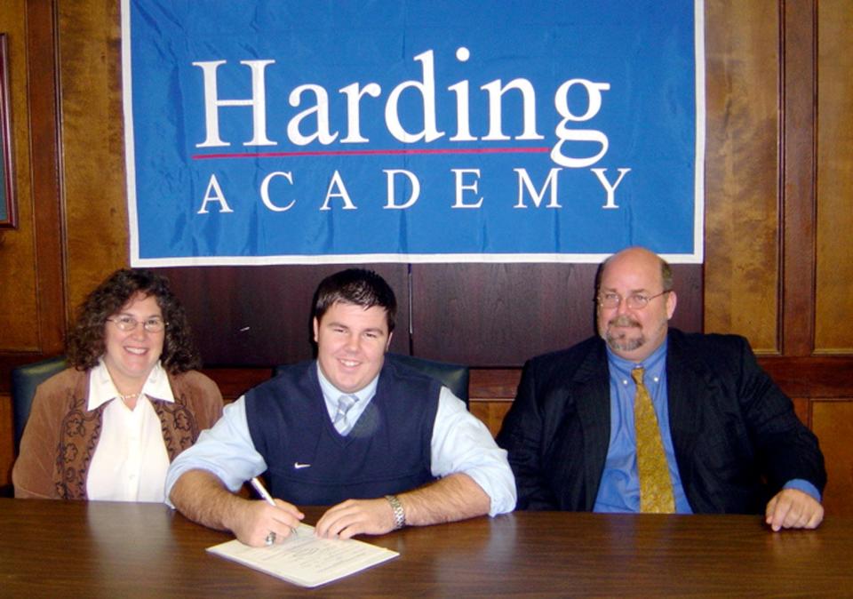 Feb. 9, 2005 - Harding Academy senior Clay Presley, with his parents Jeff and Hope Presley, signed a scholarship to play football at the University of Memphis.