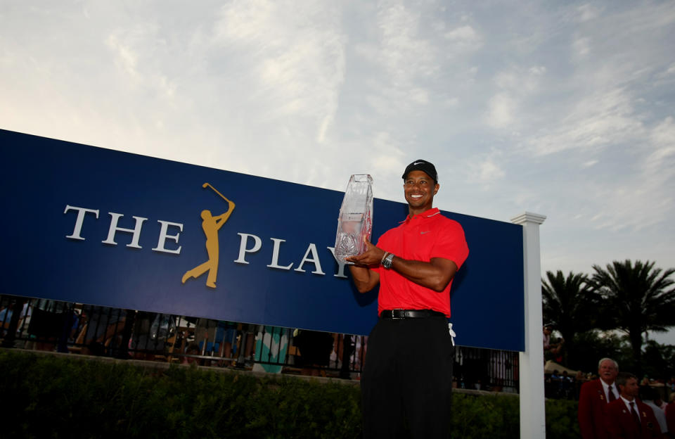 Tiger Woods holds the crystal trophy after winning the 2013 Players Championship at TPC Sawgrass.