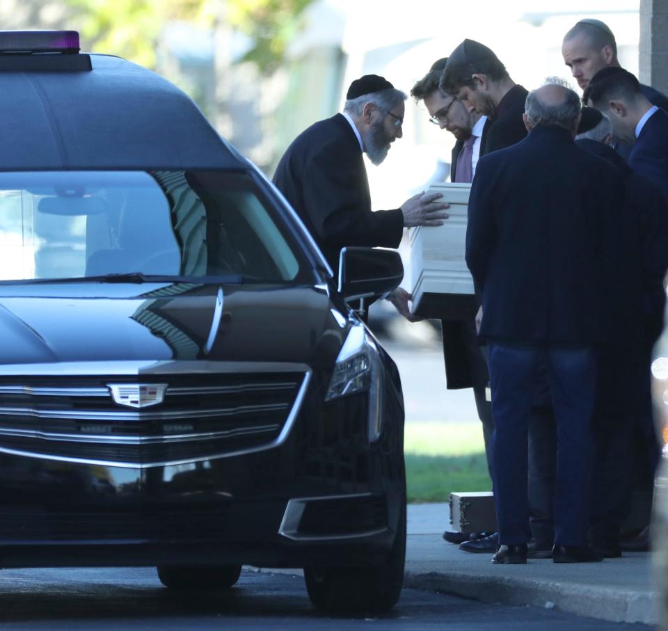 The casket of Samantha Woll is loaded into a hearse after services at the Hebrew Memorial Chapel Sunday, Oct 22, 2023. Wolf 40, was found stabbed to death near her Lafayette Park home Saturday.