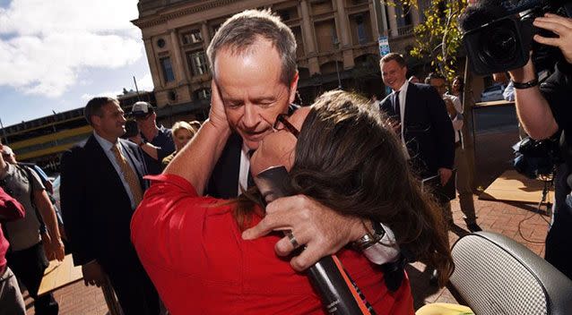 A kiss for luck. Source AAP