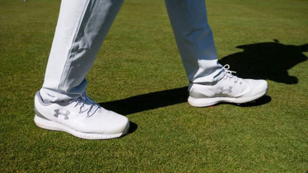 Under Armour HOVR Drive Golf Shoes, man walking wearing under armour golf shoes, white under armour golf shoes