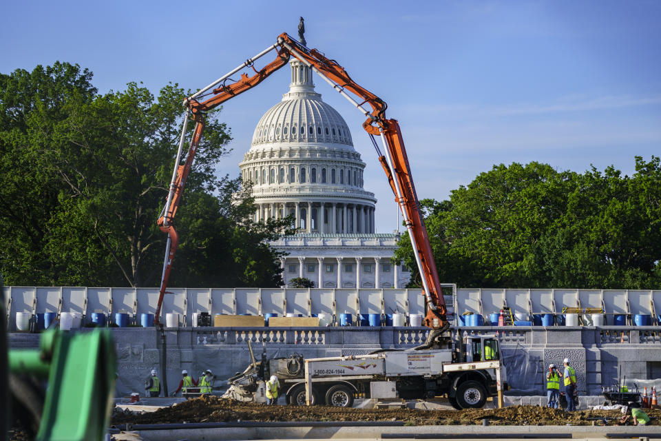 A concrete pump frames the Capitol Dome during renovations and repairs to Lower Senate Park on Capitol Hill in Washington, Tuesday, May 18, 2021. President Joe Biden hopes to pass a massive national infrastructure plan by this summer but Democrats and Republicans in Congress appear divided over his proposal for $2.3 trillion in spending to upgrade the nation's crumbling infrastructure. (AP Photo/J. Scott Applewhite)