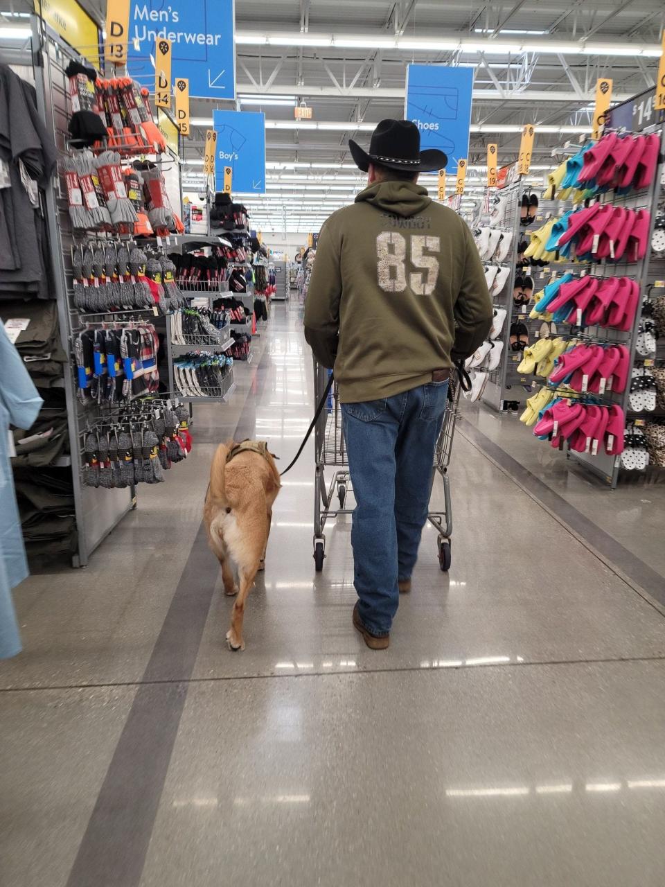Army National Guard veteran Jimmy Adkins goes shopping with his service dog, Ruby Tuesday. Dogs 2 Dog Tags paired the two together in 2019.