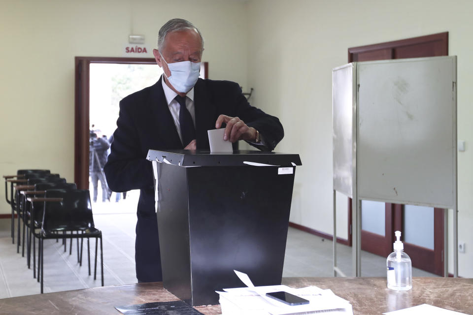 Portuguese President, and candidate for reelection, Marcelo Rebelo de Sousa casts his ballot at a polling station in Celorico de Basto, northern Portugal, Sunday, Jan. 24, 2021. Portugal holds a presidential election Sunday, choosing a head of state to serve a five-year term. (AP Photo/Luis Vieira)