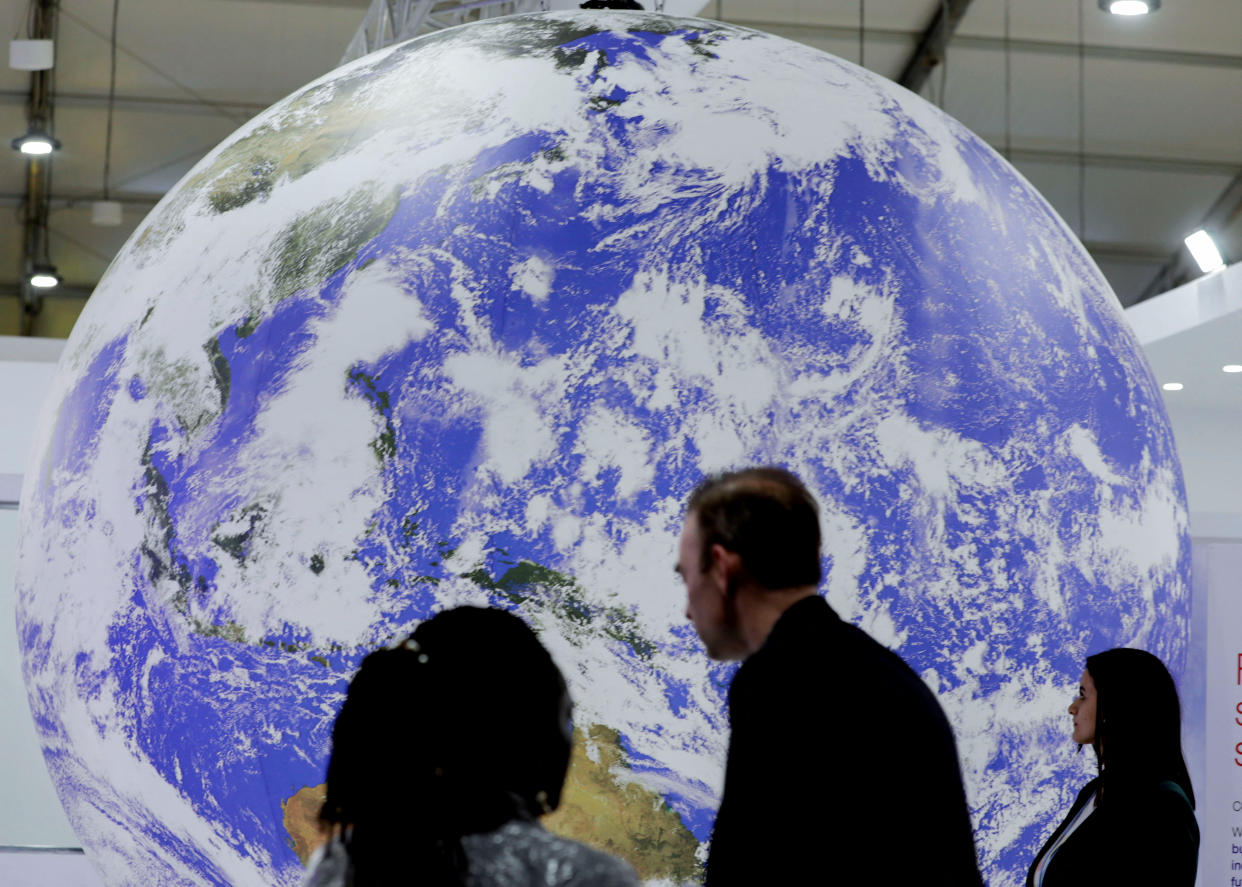 Attendees stand during the COP27 climate summit in Sharm el-Sheikh, Egypt November 9, 2022. (Reuters)