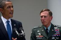 US Gen. David Petraeus (R) listens to President Barack Obama announce him as the successor of US commander in Afghanistan Gen. Stanley McChrystal, in Washington, DC in 2010. As Obama moved to draw down US forces from Afghanistan, Petraeus moved to the CIA last year at a time when the agency was heavily involved in a drone war against insurgents in Pakistan and Yemen