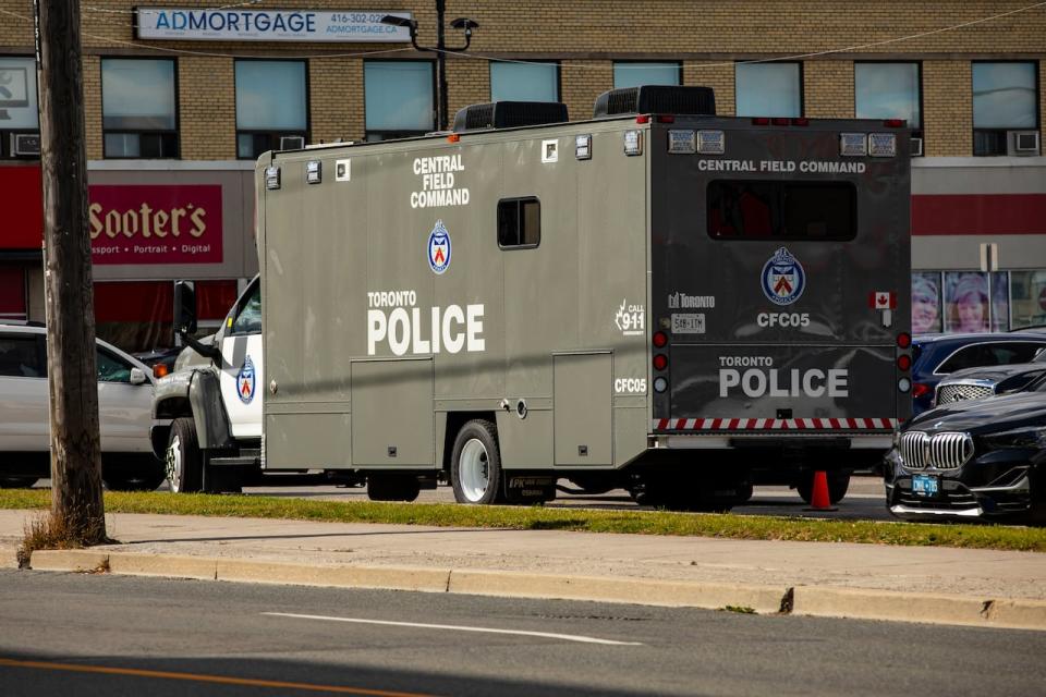 A Toronto police vehicle is parked in Lawrence Plaza on October 12, 2023.  (Michael Wilson/CBC - image credit)