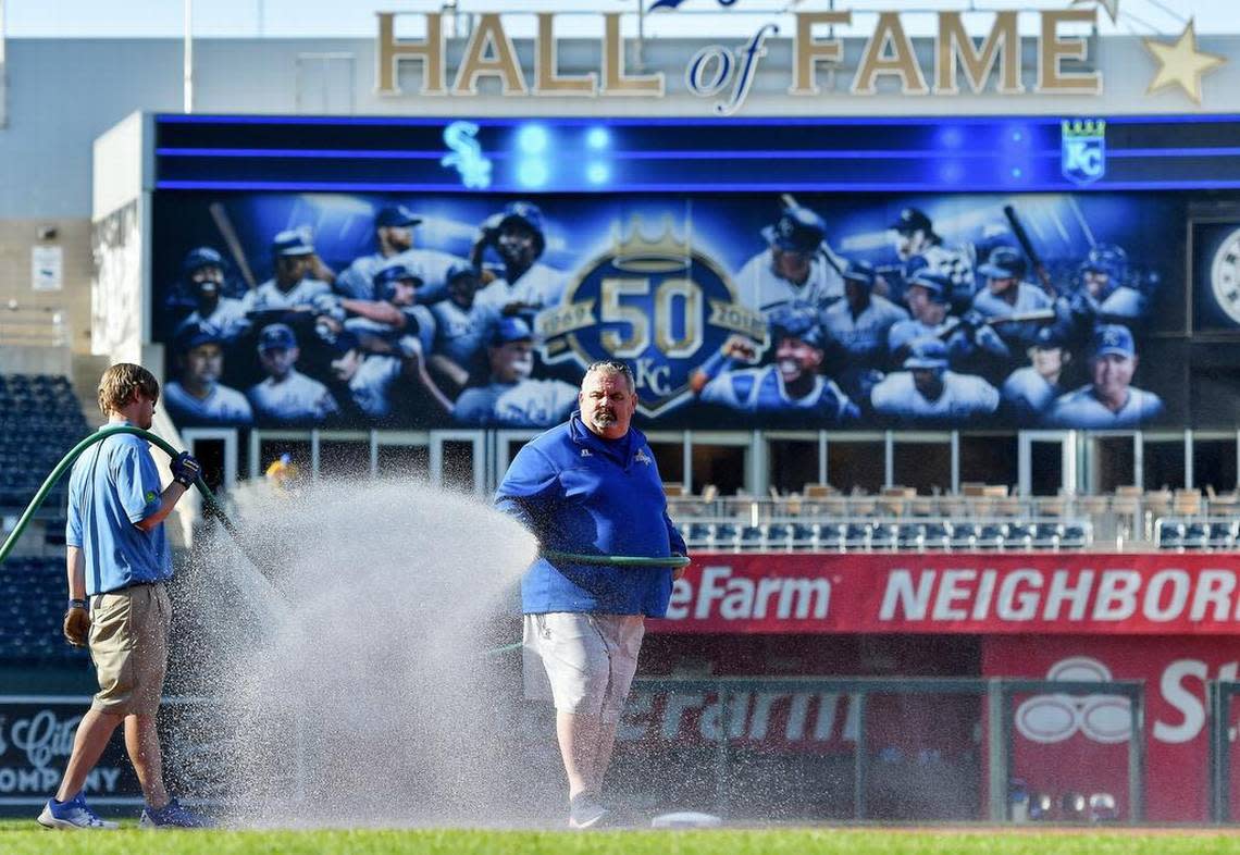 Kansas City Royals head groundskeeper Trevor Vance waters the infield before Saturday’s second baseball game of a doubleheader against the Chicago White Sox on April 28, 2018, at Kauffman Stadium in Kansas City, Mo. File photo/The Kansas City Star