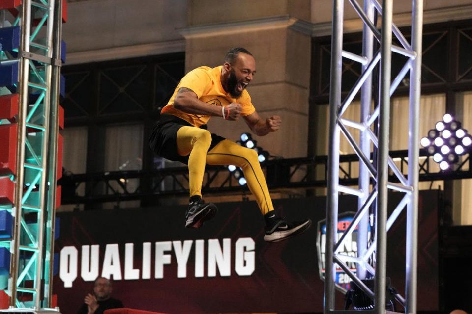 Jawon Turner yells energetically as he goes through the American Ninja Warrior course in the qualifying round in Los Angeles, California.