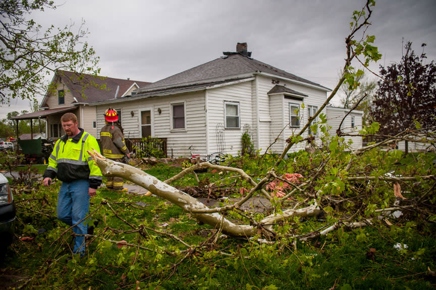 THURMAN, IA - APRIL 14: Members of local and area fire departments go house to house checking on residents after an apparent tornado April 14, 2012 in Thurman, Iowa. The storms were part of a massive system that affected areas from Northern Nebraska south through Oklahoma.