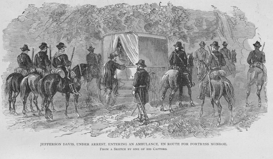 After fleeing Union forces, Confederate president Jefferson Davis, at center climbing into the carriage, was arrested on May 10, 1865. <a href="https://www.gettyimages.com/detail/news-photo/jefferson-davis-arrested-taken-to-fortress-monroe-fortress-news-photo/143853354" rel="nofollow noopener" target="_blank" data-ylk="slk:Buyenlarge/Getty Images;elm:context_link;itc:0;sec:content-canvas" class="link ">Buyenlarge/Getty Images</a>