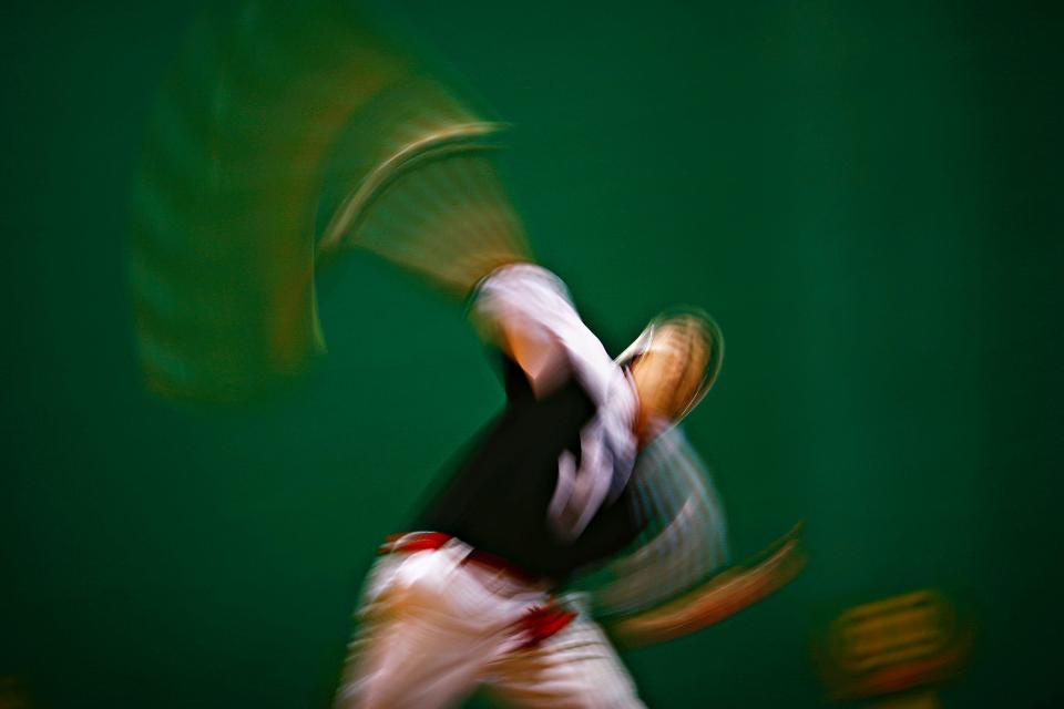 2009: Fernando Orbea serves the pelota during a Saturday night match inside the court at Ft. Pierce Jai Alai. With balls reaching speeds up to 170 m.p.h., jai alai is considered the fastest game on earth.