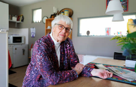 Clara Jas sits at her table in her house in Zwolle, the Netherlands April 3, 2018. Picture taken April 3, 2018. REUTERS/Michael Kooren