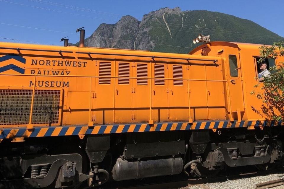 Historic coaches along the Snoqualmie Valley Railroad leave North Bend or Snoqualmie