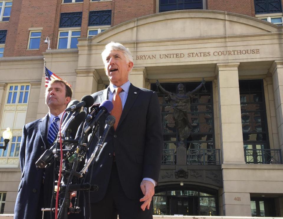 Virginia Attorney General Mark Herring, right, accompanied by Virginia Solicitor General Stuart Raphael, speaks outside the federal courthouse in Alexandria, Va., Friday, Feb. 10, 2017, following a hearing on President Donald Trump's travel ban. Lawyers for the state of Virginia are challenging President Donald Trump's executive order on immigration, arguing in federal court that his seven-nation travel ban violates the Constitution and is the result of "animus toward Muslims." (AP Photo/Jessica Gresko)