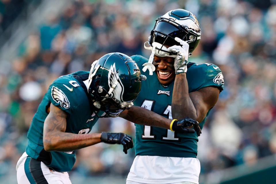 Philadelphia Eagles wide receivers DeVonta Smith (6) and A.J. Brown (11) laugh during a game against the Tennessee Titans on Sunday, Dec. 4, 2022, in Philadelphia.