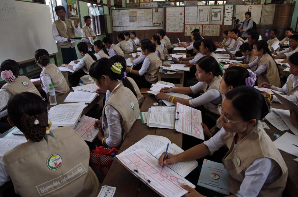 In this photo taken on March 20, 2014, teachers of basic education receive a training for nationwide census at a school in Kyaung Gone township, Myanmar. As Myanmar continues its transition from decades of military rule and self-imposed isolation, it is about to carry out a census that experts say is crucial for national planning and development, but also likely to inflame already soaring ethnic and religious tensions. (AP Photo/Khin Maung Win)