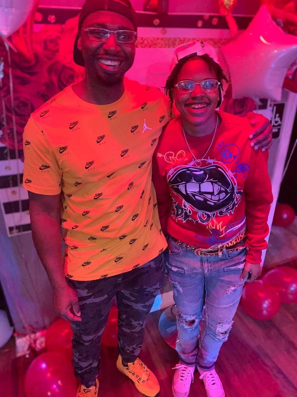 Marlin Dixon poses with his daughter, Kamariya, at her 19th birthday party in 2021. Dixon threw her the surprise party, the first birthday party she ever had.