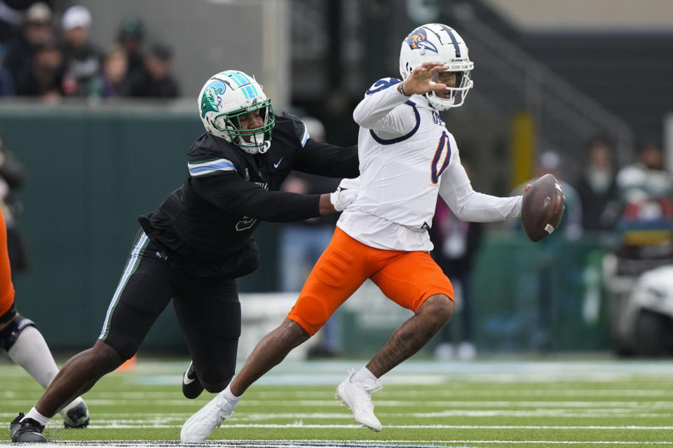 UTSA quarterback Frank Harris (0) is sacked by Tulane defensive lineman Keith Cooper Jr. in the first half of an NCAA college football game in New Orleans, Friday, Nov. 24, 2023. (AP Photo/Gerald Herbert)