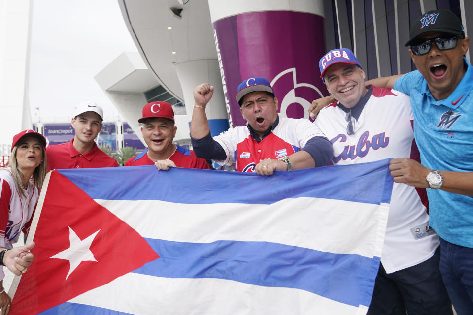Cuba fans enter LoanDepot park for of a World Baseball Classic quarterfinal game between Cuba and U.S., Sunday, March 19, 2023, in Miami. (AP Photo/Marta Lavandier)