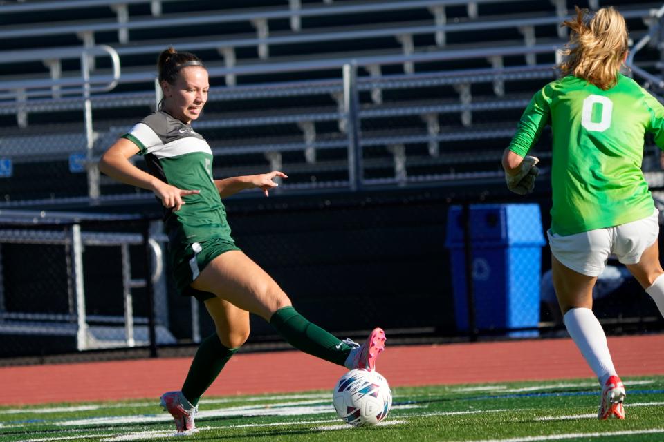 Olivia Poradka of Kinnelon is shown with the ball as she approaches Gisele Longo of Villa Walsh, Tuesday, October 3, 2023.