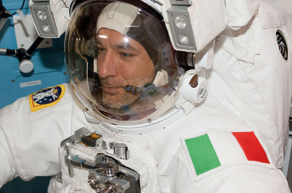 Clad in a white spacesuit with his country's green, white and red flag decorating his left shoulder, Luca Parmitano emerged from the International Space Station to become Italy's first astronaut to walk in space on July 9, 2013. Prior to his ex