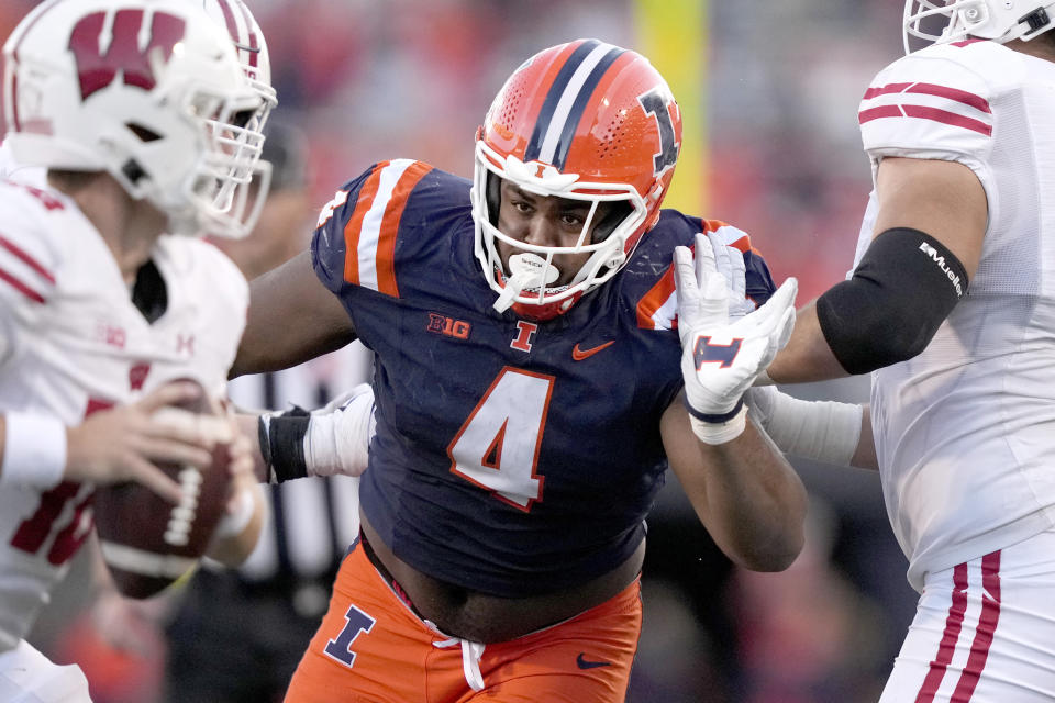 FILE - Illinois defensive lineman Jer'Zhan Newton rushes the quarterback during an NCAA college football game against Wisconsin, Saturday, Oct. 21, 2023, in Champaign, Ill. (AP Photo/Charles Rex Arbogast, File)