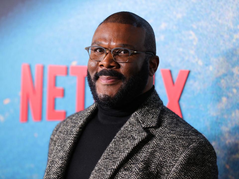 Tyler Perry in a gery jacket and black turtleneck