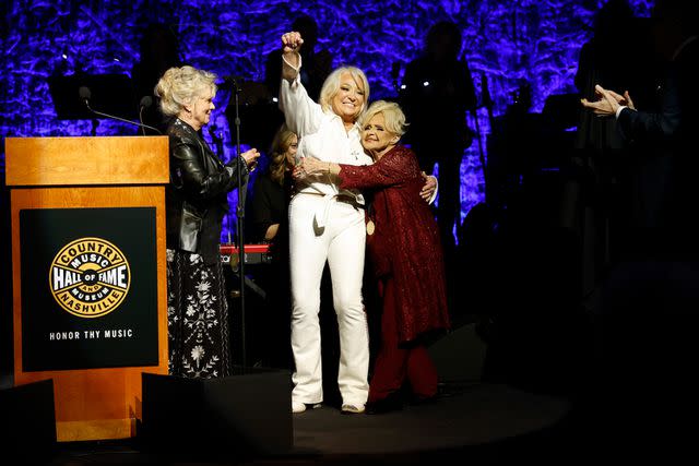 <p>Jason Kempin/Getty</p> Connie Smith, honoree Tanya Tucker and Brenda Lee speak onstage during the Class of 2023 Medallion Ceremony at Country Music Hall of Fame and Museum on Oct. 22, 2023 in Nashville