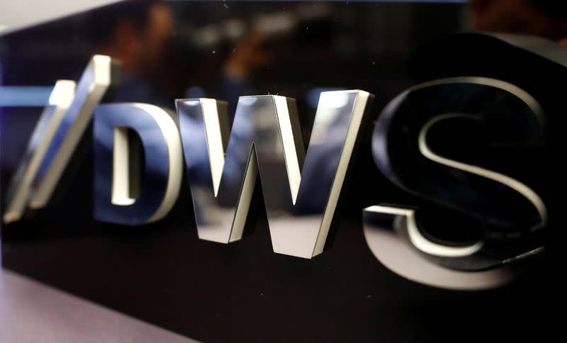 FILE PHOTO: Logo of Deutsche Bank's asset management unit DWS is pictured at the Frankfurt Stock Exchange