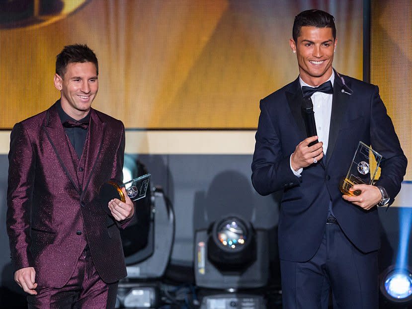 FIFA Ballon d'Or nominees Lionel Messi of Argentina and FC Barcelona (L) and Cristiano Ronaldo of Portugal and Real Madrid smile during the FIFA Ballon d'Or Gala 2014 at the Kongresshaus on January 12, 2015 in Zurich, Switzerland.