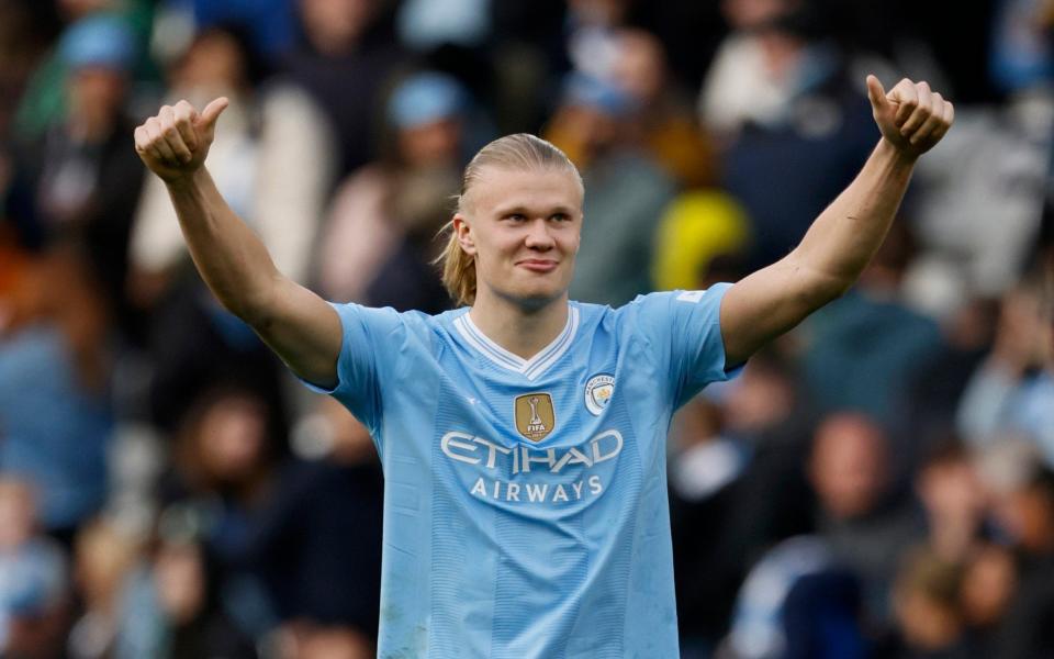 Manchester City's Erling Haaland salutes the fans after the Premier League match at the Etihad Stadium