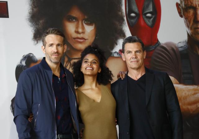 (L-R) Cast members Ryan Reynolds, Zazie Beetz and Josh Brolin pose for a picture during a photo call for the movie “Deadpool 2” ahead of the premiere in Berlin, Germany May 11, 2018. REUTERS/Fabrizio Bensch