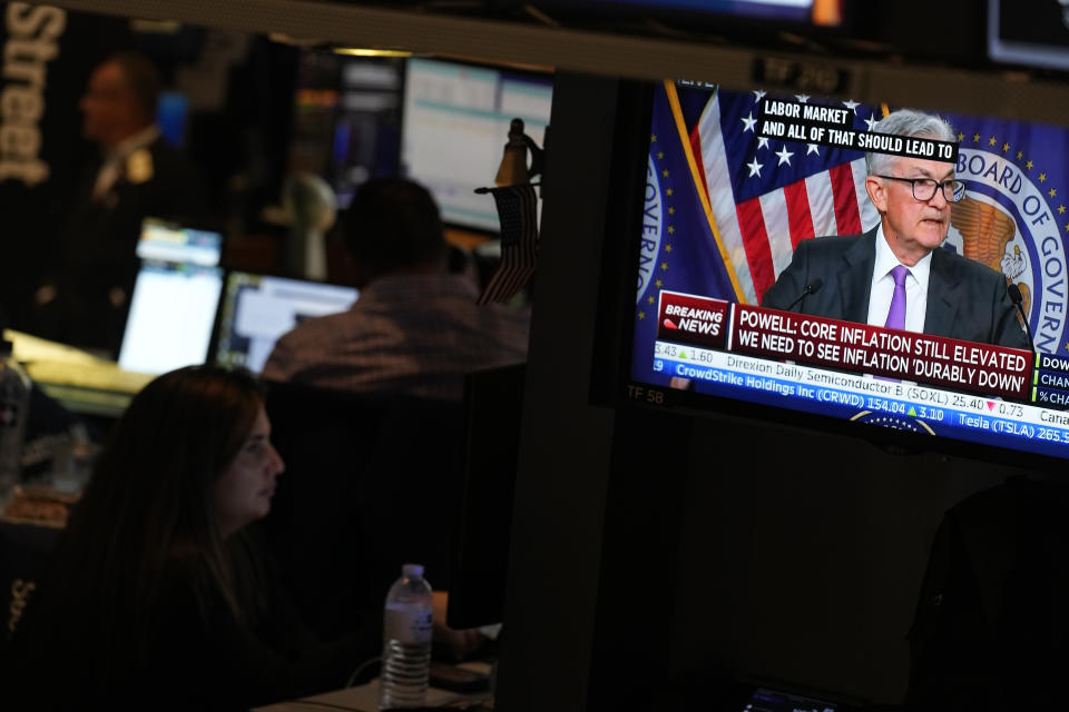 Federal Reserve Chairman Jerome Powell's news conference is displayed on a monitor on the floor at the New York Stock Exchange in New York, Wednesday, July 26, 2023. Stocks are mixed after the Federal Reserve followed through on Wall Street's expectations and raised its benchmark interest rate to its highest level in more than two decades. (AP Photo/Seth Wenig)