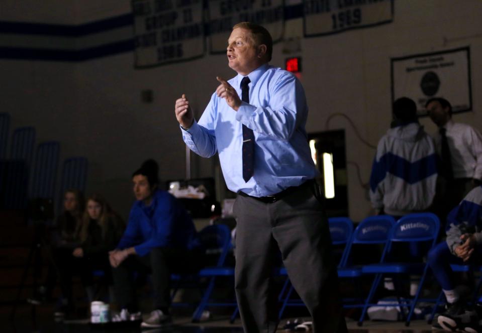 Kittatinny' wrestling coach John Gill talks to one of his wrestlers during a home match against North Warren on Jan. 6, 2016, at Kittatinny Regional High School.