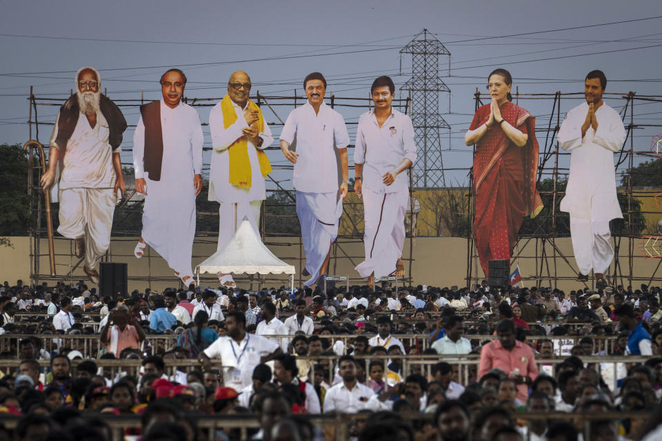 Large cutouts representing Dravida Munnetra Kazhagam and Indian National Congress leaders, tower over supporters during an election campaign rally, on the outskirts of southern Chennai, India, April 15, 2024. Millions of Indians will begin voting in a six-week election that's a referendum on the populist prime minister who has championed a brand of Hindu nationalist politics and is seeking a rare third term as the country's leader. (AP Photo/Altaf Qadri)